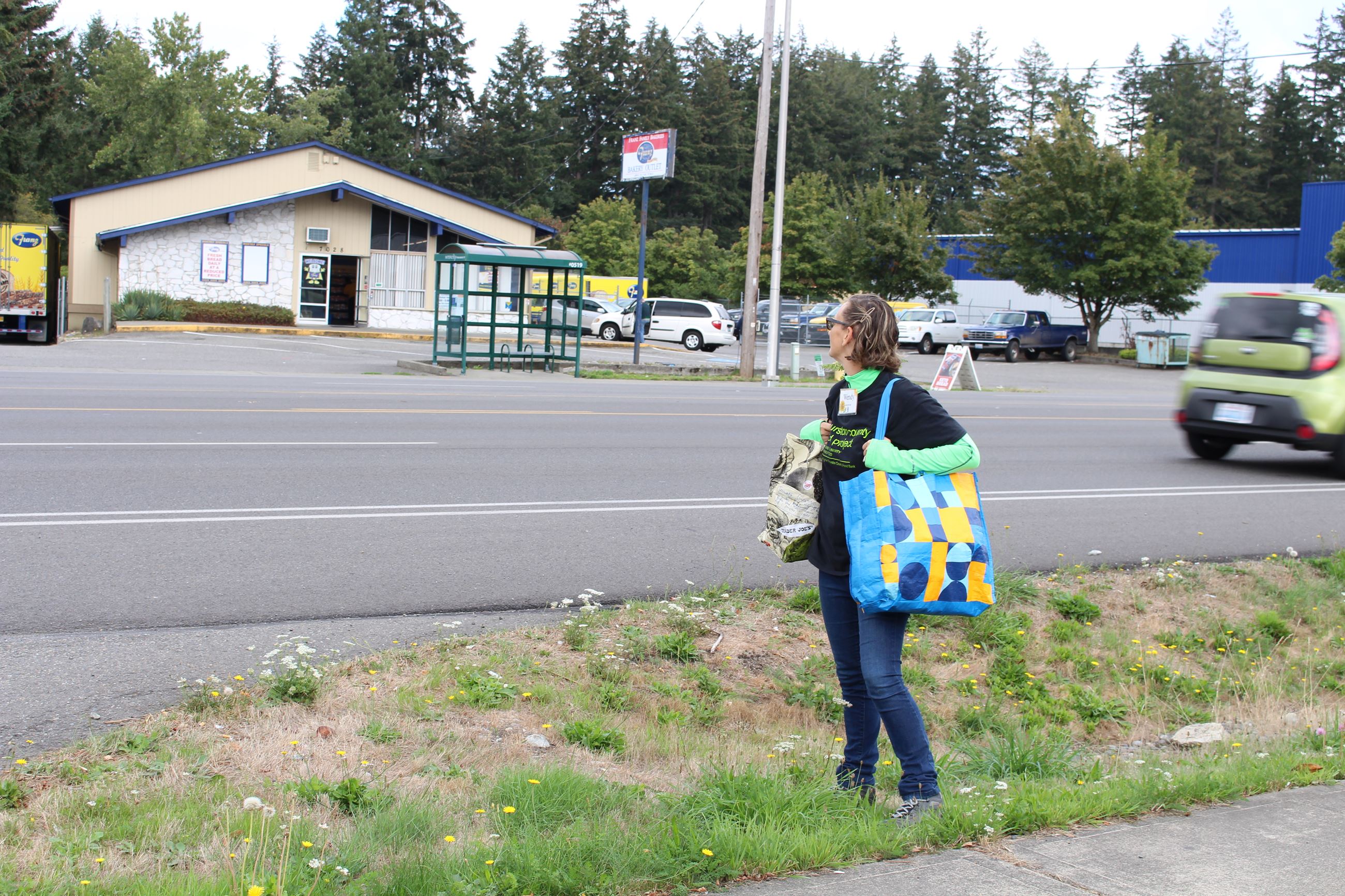 A Thurston County Food Bank volunteer looks across Martin Way.
